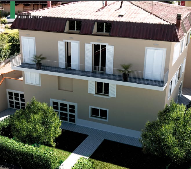 Rendering di Villa Benedetta: il fronte con la terrazza continua e i garage al piano terra.